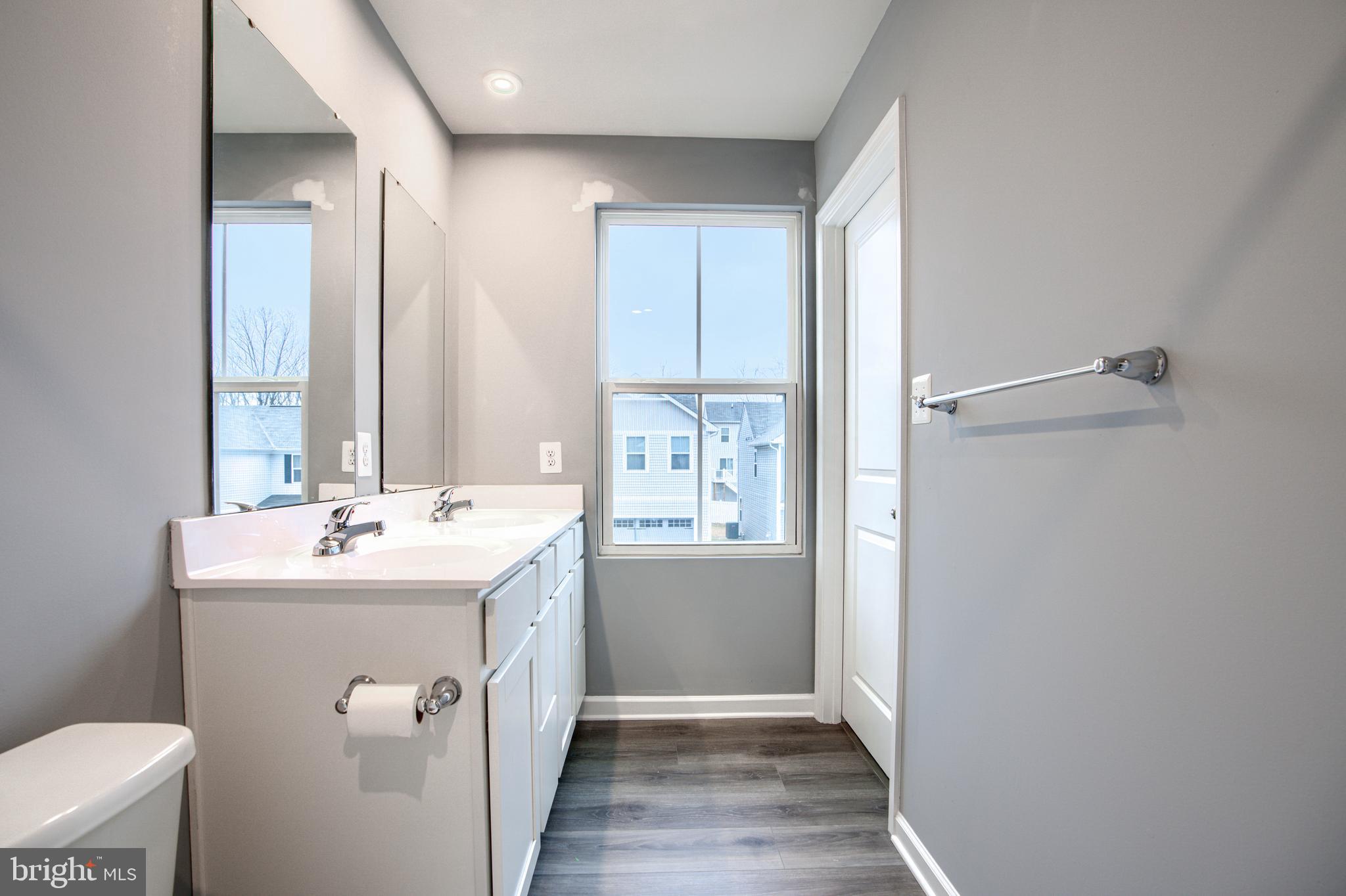 104 Magnolia Drive Elkton, MD 21921 - Photo 23 of 52 a bathroom with a sink a toilet and mirror