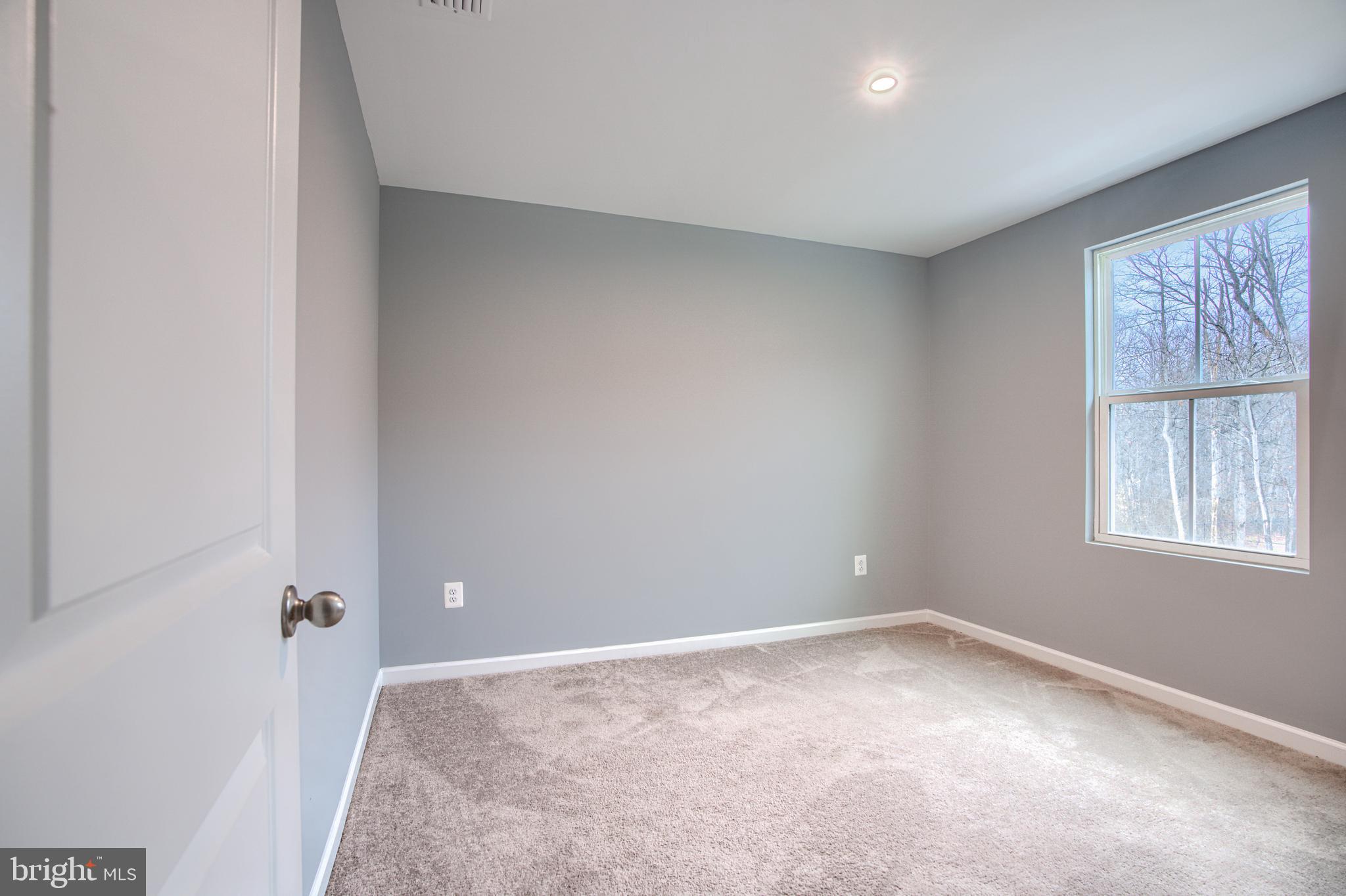 104 Magnolia Drive Elkton, MD 21921 - Photo 28 of 52 an empty room with a window