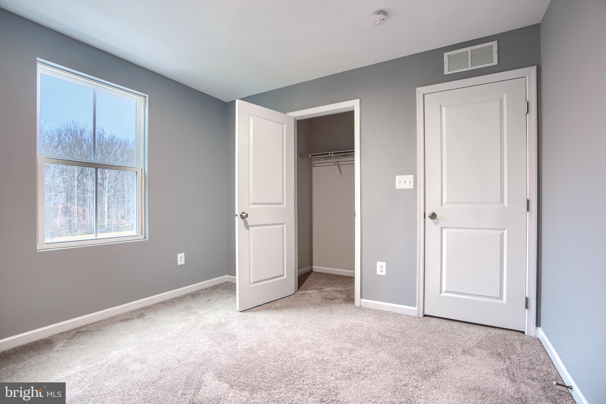 104 Magnolia Drive Elkton, MD 21921 - Photo 31 of 52 an empty room with windows and closet