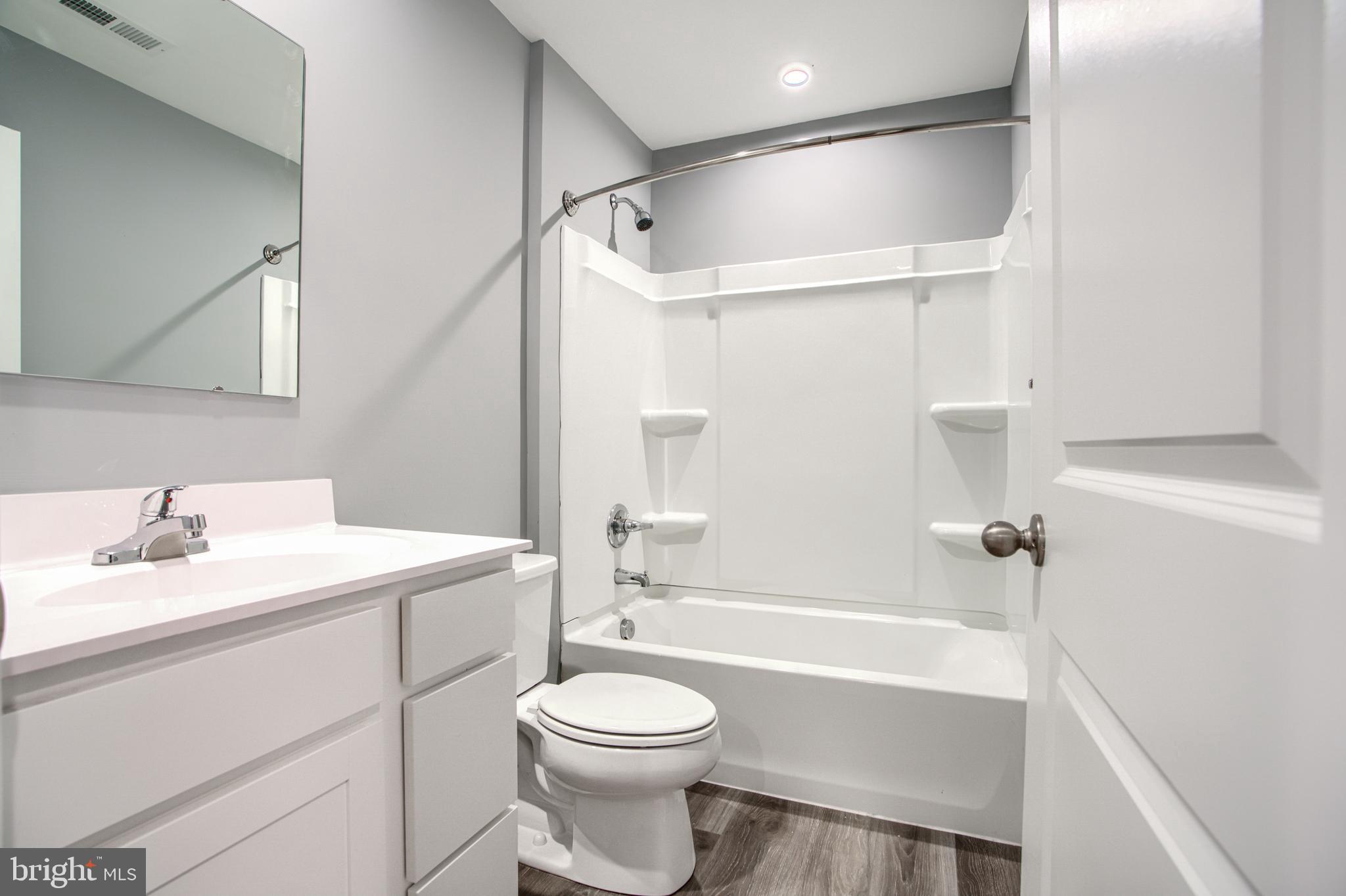 104 Magnolia Drive Elkton, MD 21921 - Photo 36 of 52 a bathroom with a sink a toilet and a bathtub