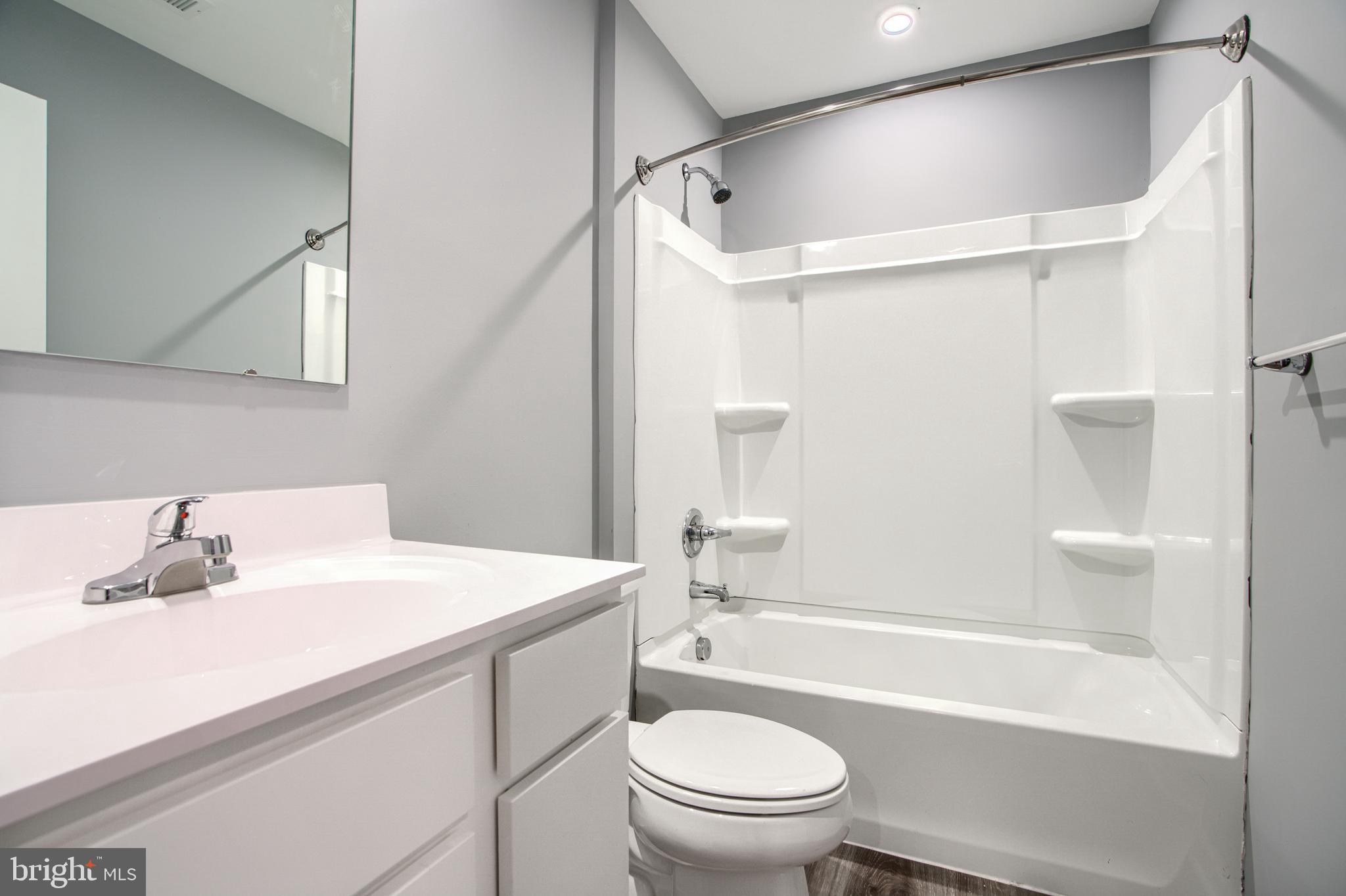 104 Magnolia Drive Elkton, MD 21921 - Photo 37 of 52 a bathroom with a sink a toilet and a bathtub
