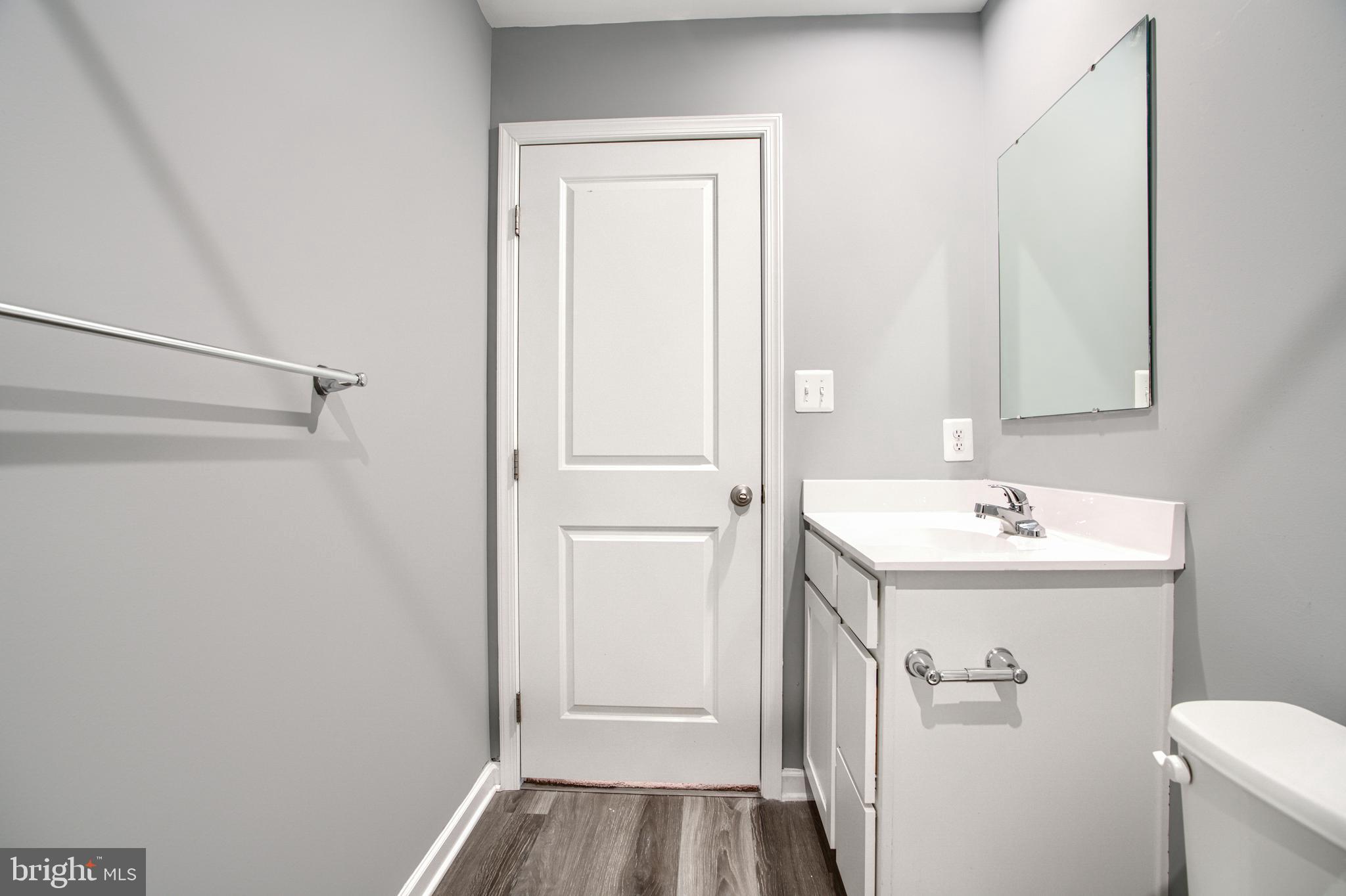 104 Magnolia Drive Elkton, MD 21921 - Photo 38 of 52 a bathroom with a sink and mirror with toilet
