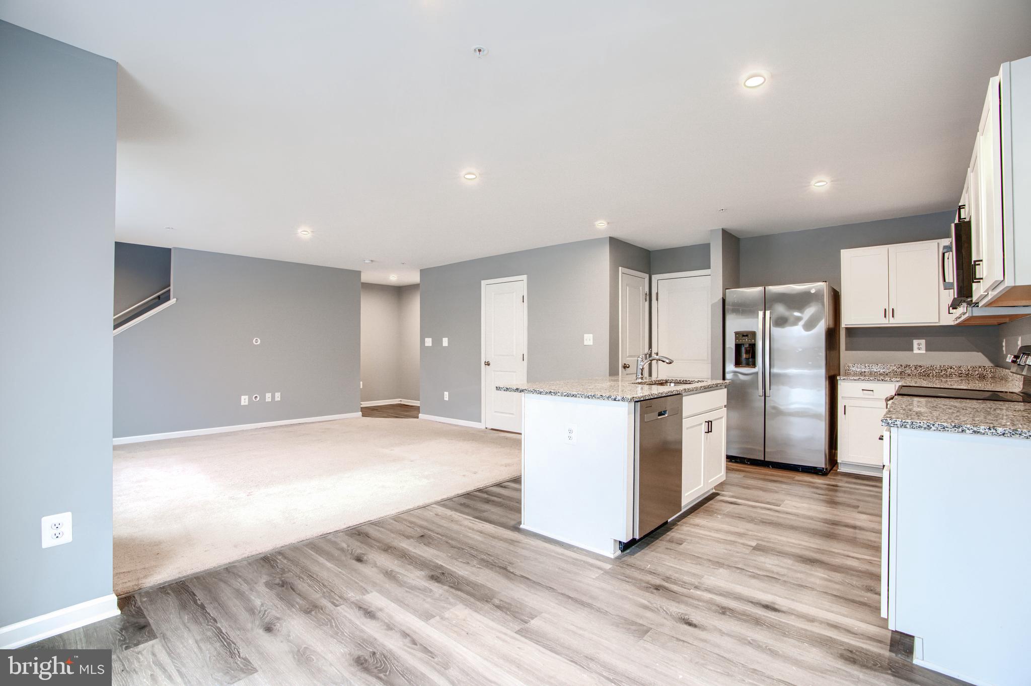 104 Magnolia Drive Elkton, MD 21921 - Photo 10 of 52 a kitchen with refrigerator and cabinets