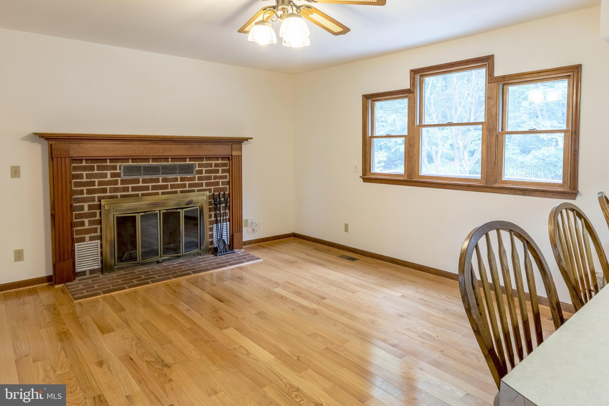 8135 Moormont Road Rapidan, VA 22733 - Photo 8 of 61 Open Kitchen/dining area with wood fireplace