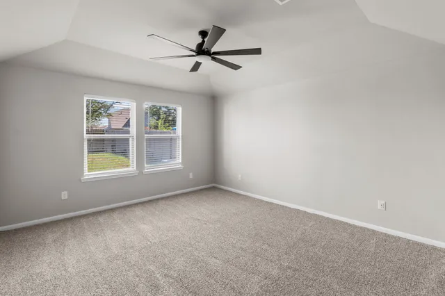 a view of room with window and ceiling fan