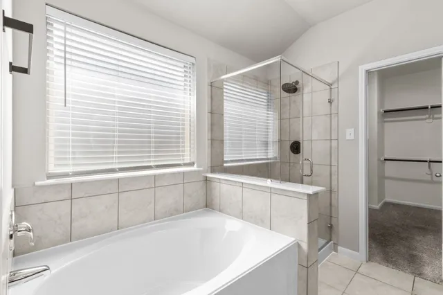 a bathroom with a bathtub and a sink