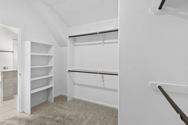 a view of an empty walk in closet
