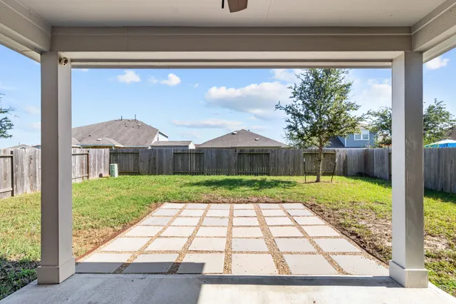 a view of backyard with green space
