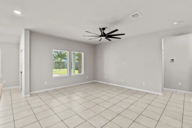 a view of an empty room and window