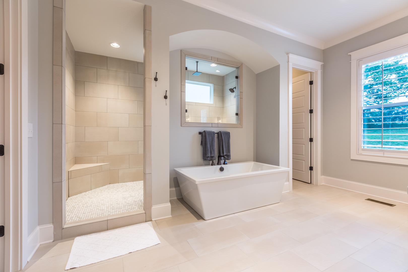 4119 Old Light Circle Arrington, TN 37014 - Photo 17 of 25 a spacious bedroom with a bed and a mirror