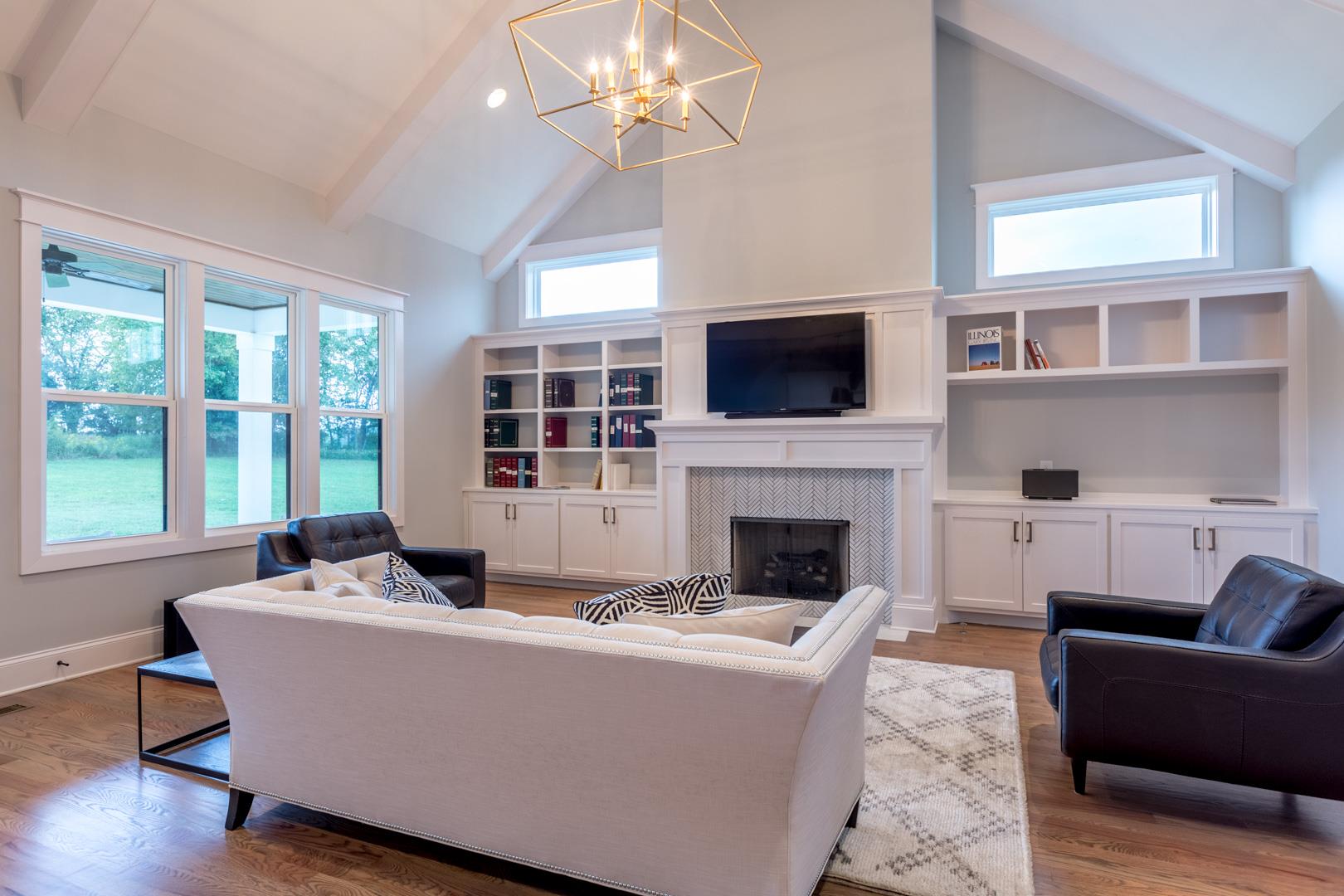 4119 Old Light Circle Arrington, TN 37014 - Photo 3 of 25 a living room with furniture a fireplace and a flat screen tv