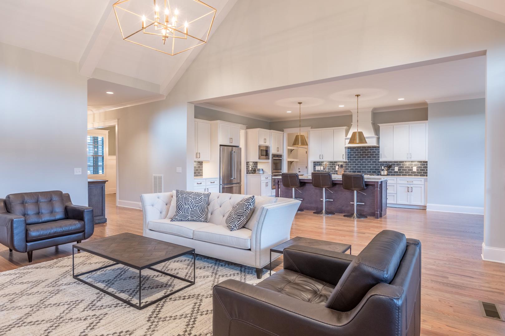 4119 Old Light Circle Arrington, TN 37014 - Photo 5 of 25 a living room with furniture or kitchen view and a chandelier