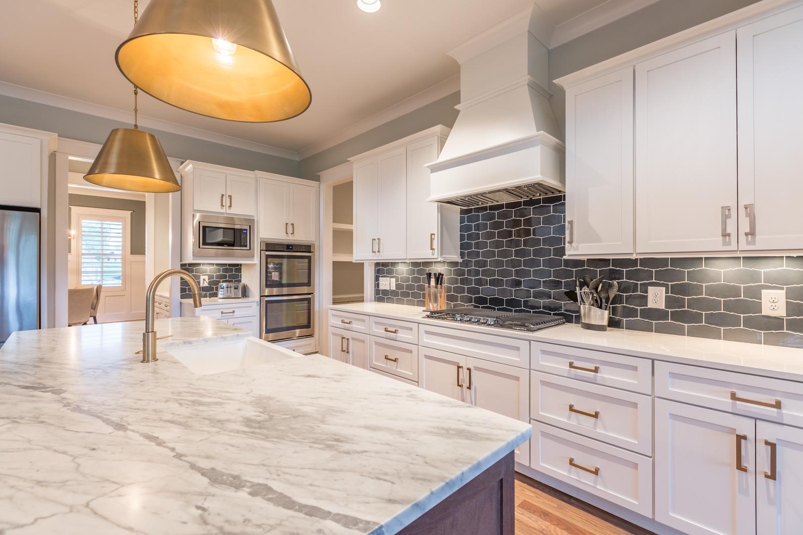 4119 Old Light Circle Arrington, TN 37014 - Photo 9 of 25 a kitchen with granite countertop a sink a stove and cabinets