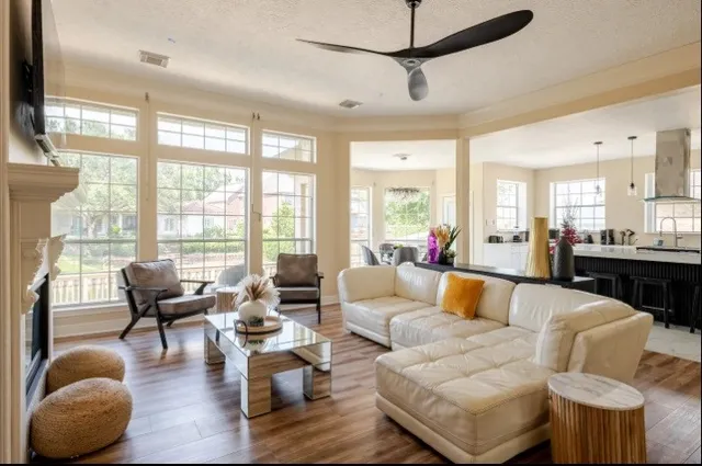 a living room with furniture and a large window