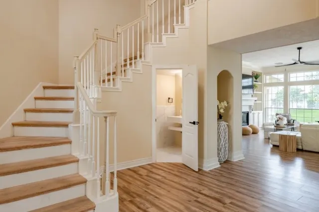 a view of entryway and hall with wooden floor