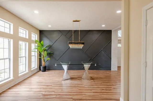 a view of entryway and hall with wooden floor