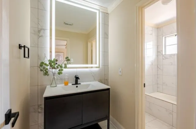 a bathroom with a sink and a mirror