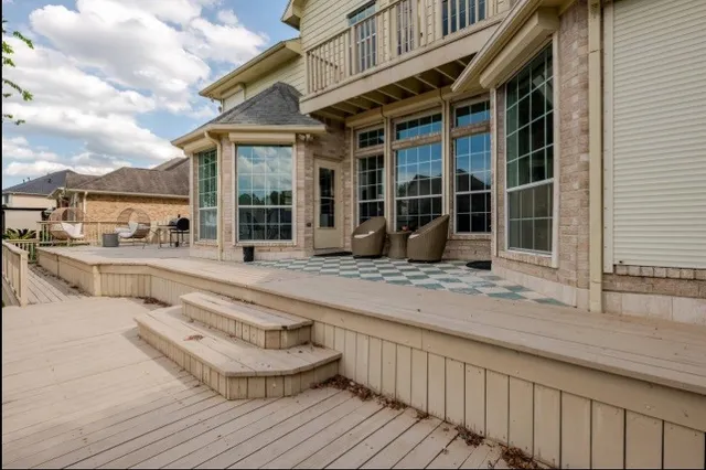 a swimming pool with outdoor seating and yard