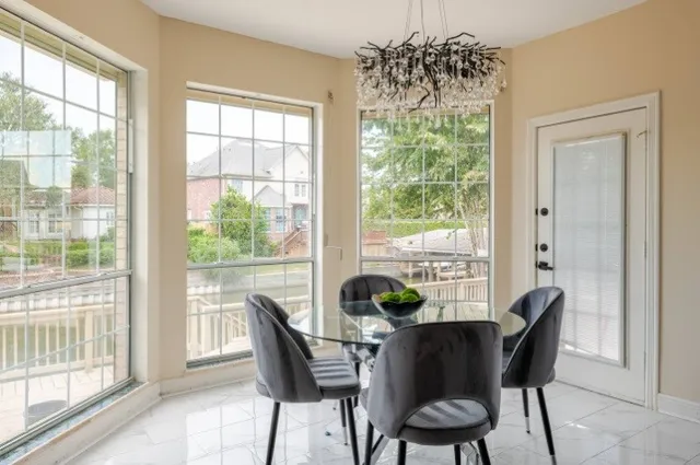 a dining room with furniture and window