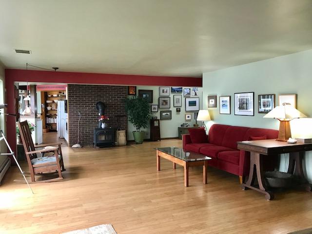 127 Paul Bunyan Road Corea, ME 04624 - Photo 20 of 46 Living room w/slider to waterside deck.