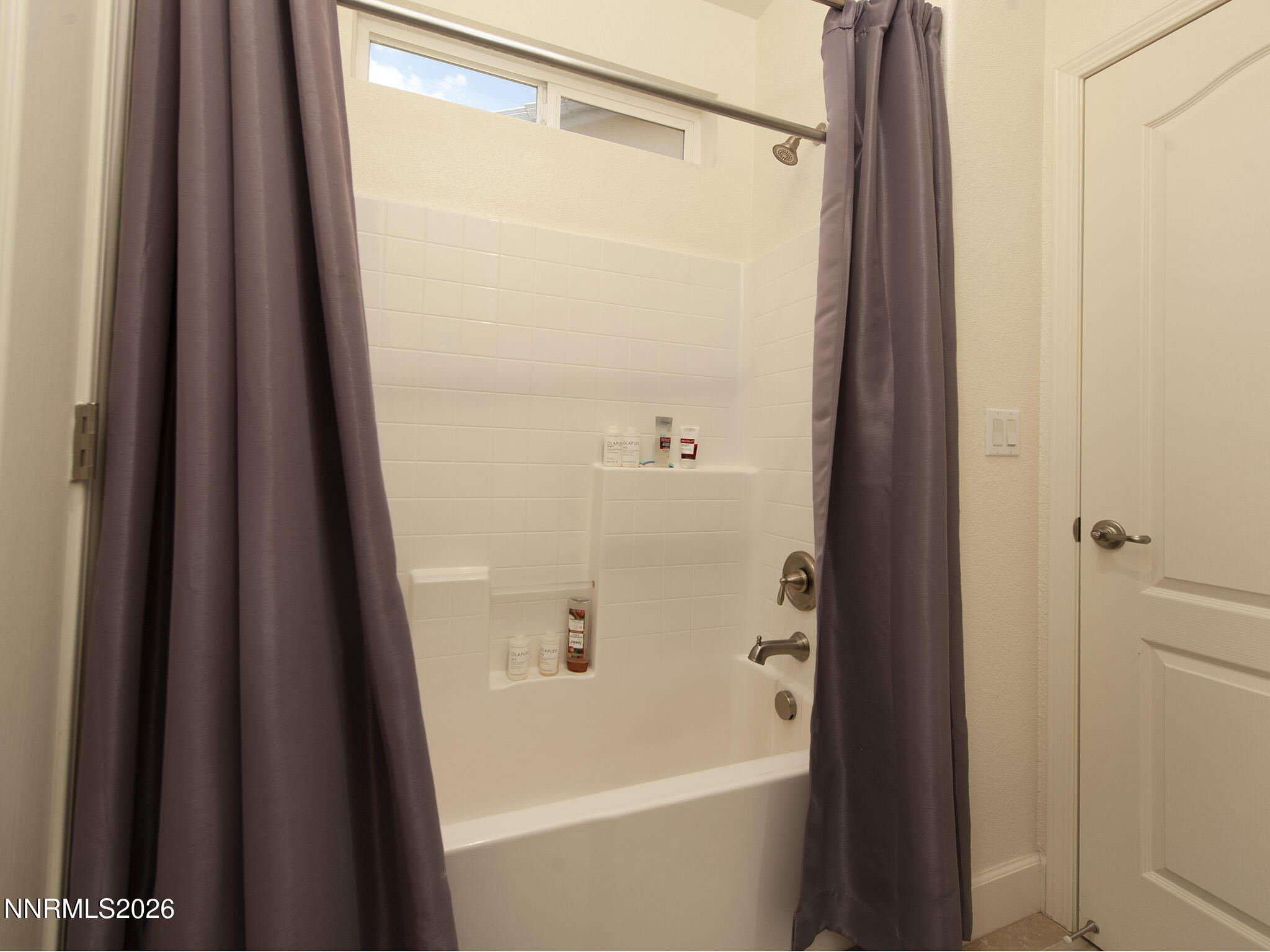 9766 Pachuca Drive Reno, NV 89521 - Photo 39 of 59 a bathroom with a shower curtain and a sink