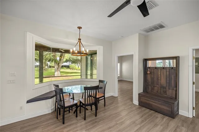 a dining room with furniture window wooden floor