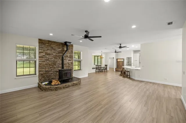 a view of a livingroom with furniture and a ceiling fan
