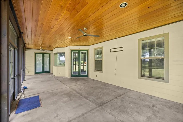 a view of a swimming pool with sitting area