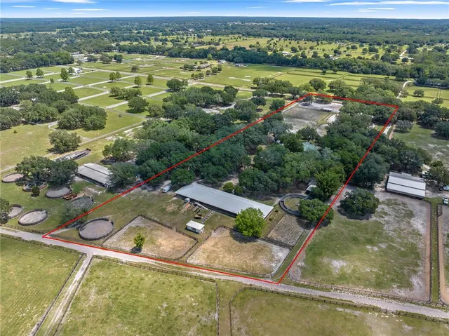 a view of a swimming pool with a yard