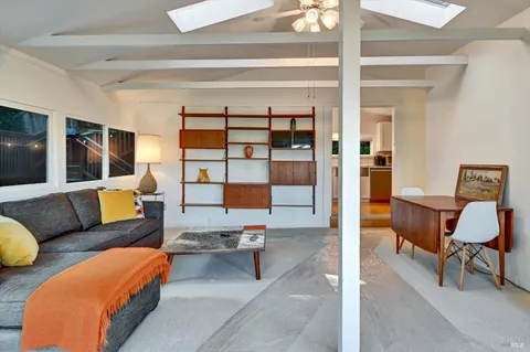 a living room with furniture and view of living room