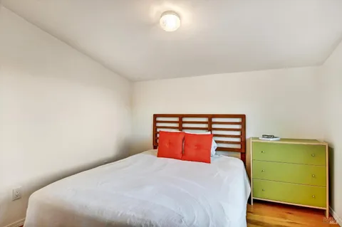 a bedroom with a bed and window