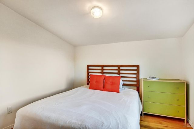 a bedroom with a bed and window