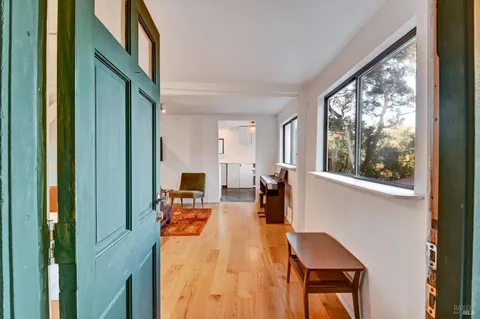 a view of a living room and dining room