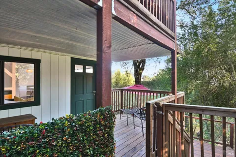 a view of a two chairs in the balcony