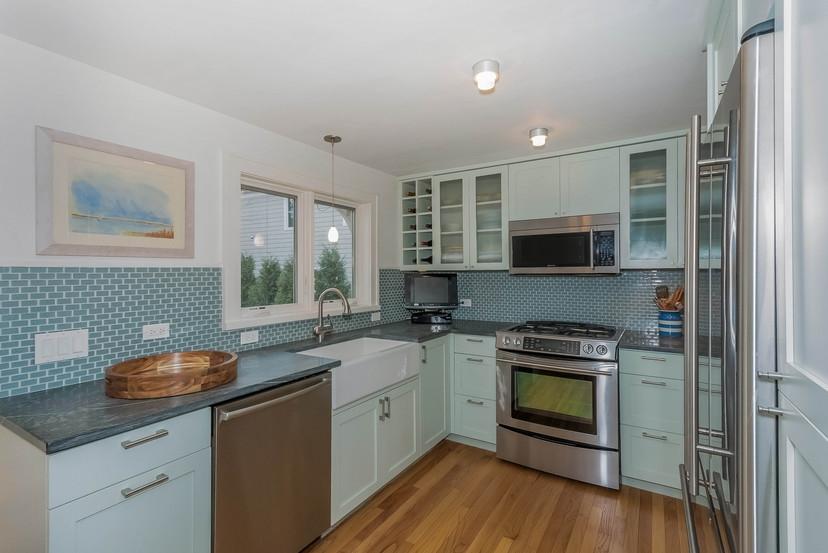 63 Roton Avenue Rowayton, CT 06853 - Photo 11 of 30 a kitchen with a sink stove and microwave