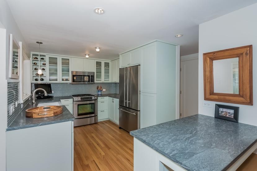 63 Roton Avenue Rowayton, CT 06853 - Photo 12 of 30 a kitchen with stainless steel appliances granite countertop a refrigerator a stove top oven a sink and dishwasher