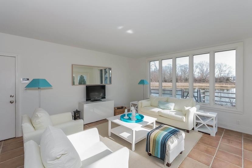 63 Roton Avenue Rowayton, CT 06853 - Photo 15 of 30 a living room with furniture and a flat screen tv