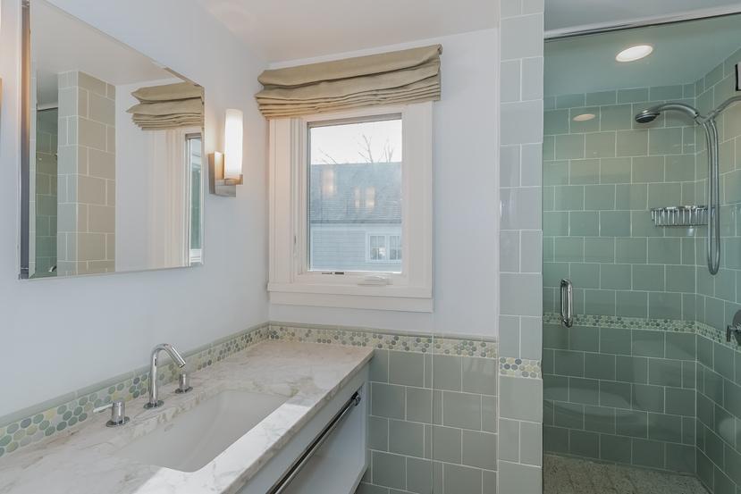 63 Roton Avenue Rowayton, CT 06853 - Photo 20 of 30 a bathroom with a granite countertop sink a mirror and shower