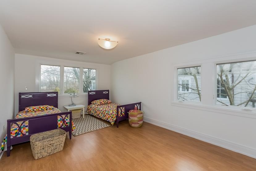 63 Roton Avenue Rowayton, CT 06853 - Photo 21 of 30 a bedroom with furniture and a large window
