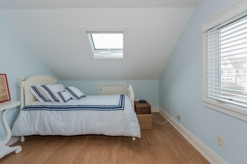 63 Roton Avenue Rowayton, CT 06853 - Photo 22 of 30 a living room with a couch wooden floor and a window