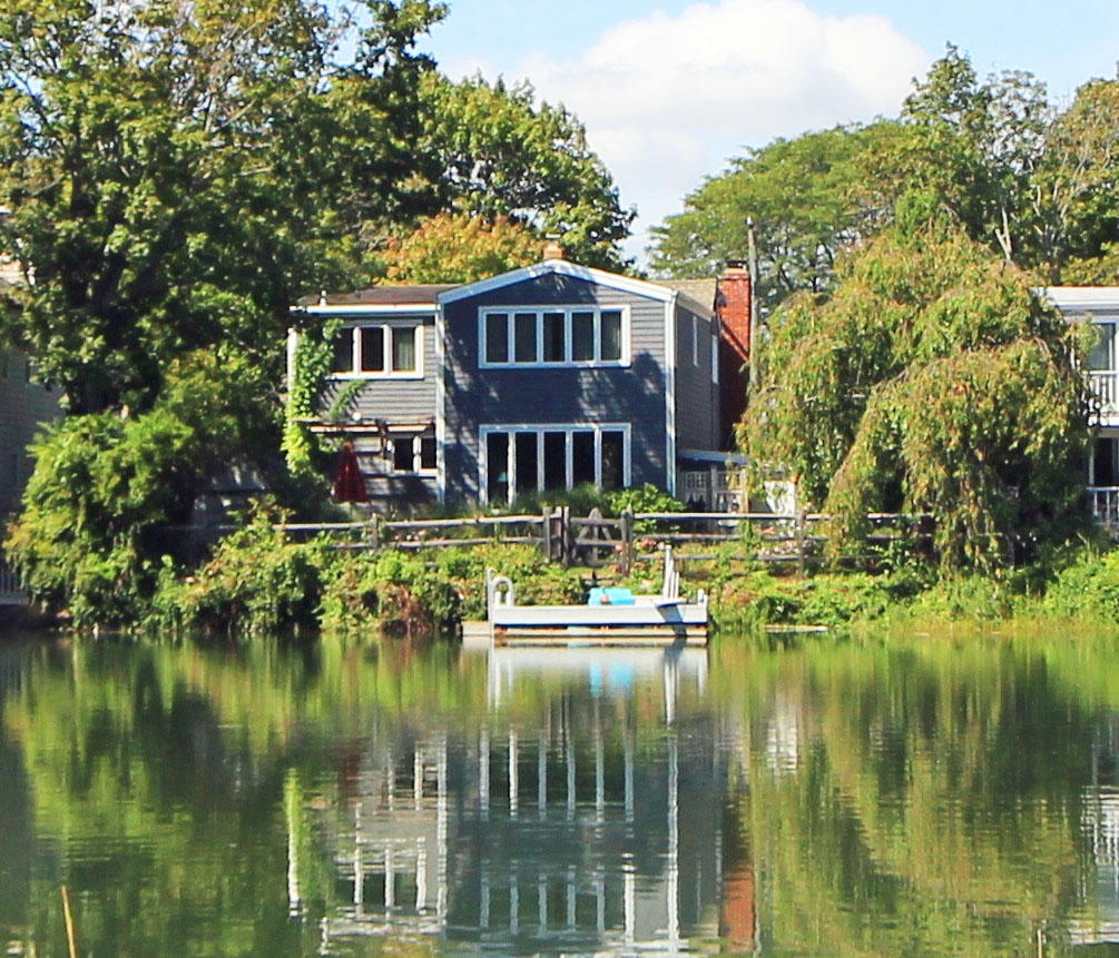 63 Roton Avenue Rowayton, CT 06853 - Photo 7 of 30 a front view of a house with a lake view