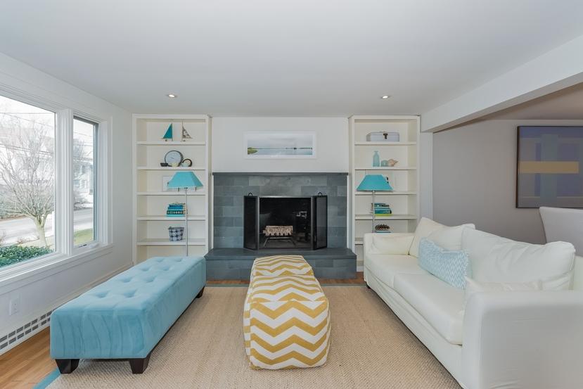 63 Roton Avenue Rowayton, CT 06853 - Photo 10 of 30 a living room with furniture and a fireplace