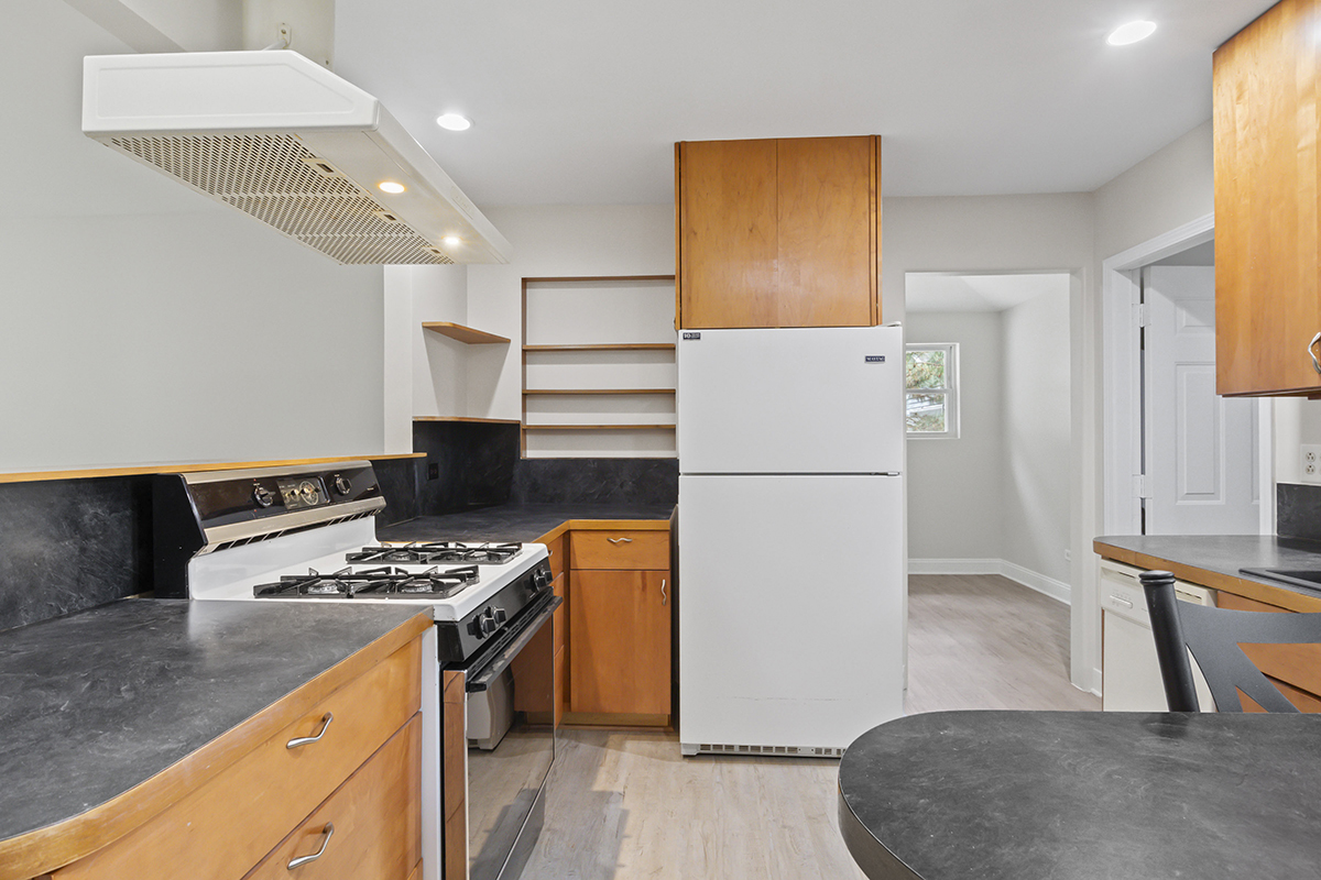2900 Swallow Lane Rolling Meadows, IL 60008 - Photo 11 of 37 a kitchen with stainless steel appliances granite countertop a refrigerator a stove and a sink
