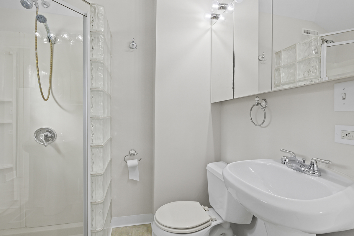 2900 Swallow Lane Rolling Meadows, IL 60008 - Photo 15 of 37 a bathroom with a toilet sink and shower