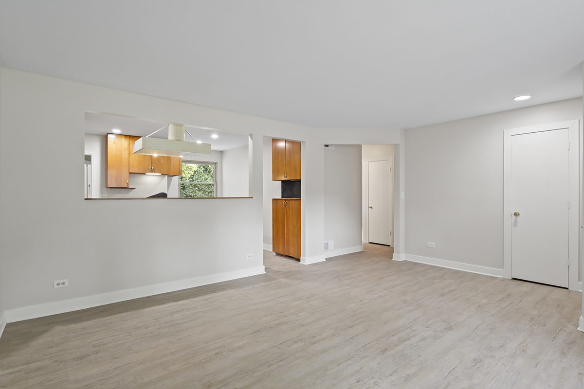 2900 Swallow Lane Rolling Meadows, IL 60008 - Photo 7 of 37 an empty room with a window and a kitchen