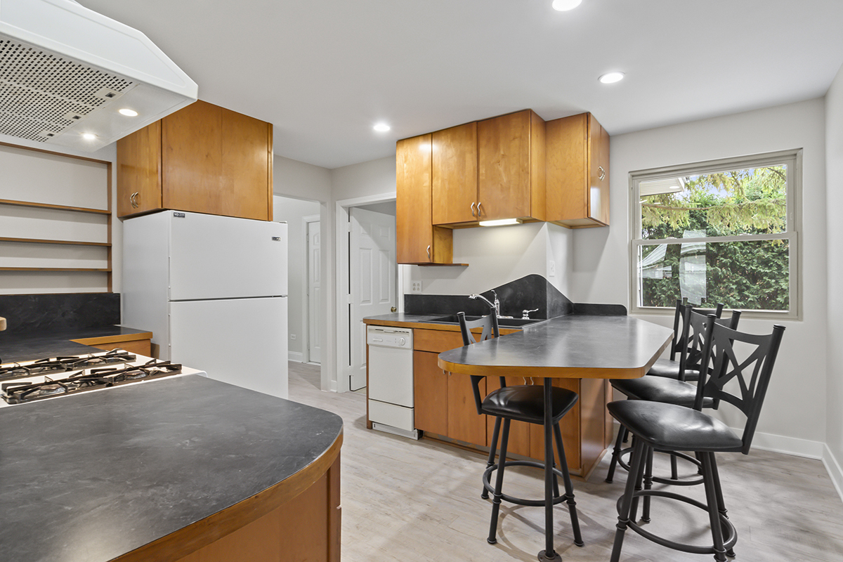 2900 Swallow Lane Rolling Meadows, IL 60008 - Photo 9 of 37 a kitchen with dining table and chairs