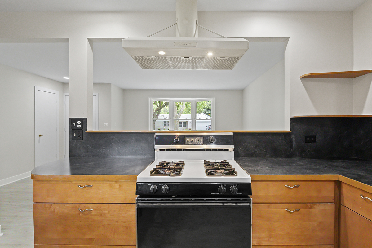 2900 Swallow Lane Rolling Meadows, IL 60008 - Photo 10 of 37 a kitchen with a stove a sink and a refrigerator
