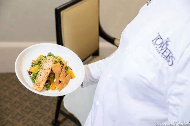 a view of a dining room with furniture and a livingroom