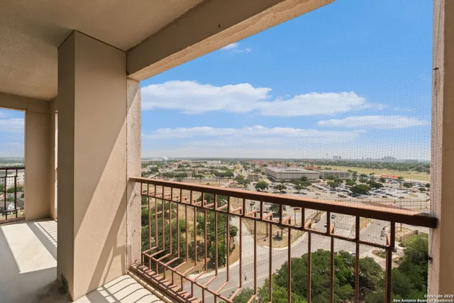 a view of a city skyline from a balcony