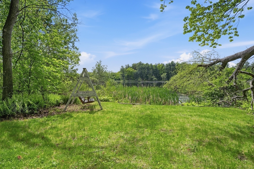 43 Flint Road Tyngsborough, MA 01879 - Photo 30 of 40 a view of a garden with a lake